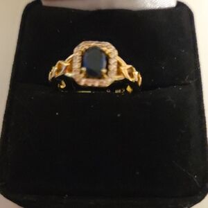 Gold Moissonite Ring with Dark Blue Stone and Halo Accent